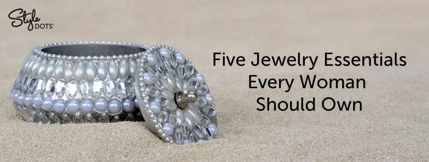 A bejeweled jewelry box with title, "Five Jewelry Essentials Every Woman Should Own